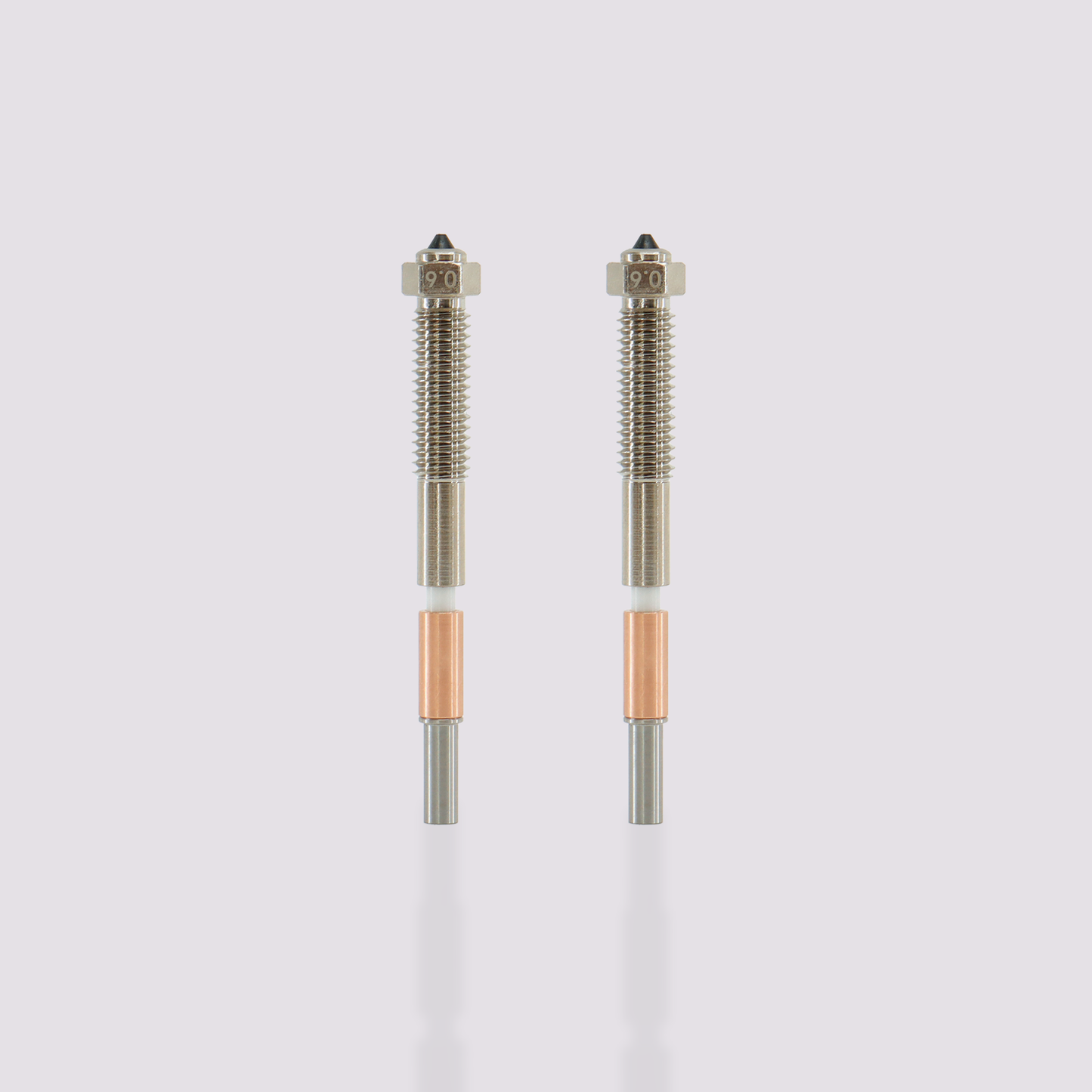 Two QIDI Max4 bimetal nozzles with 0.6mm markings, featuring integrated all-metal design for easy replacement.