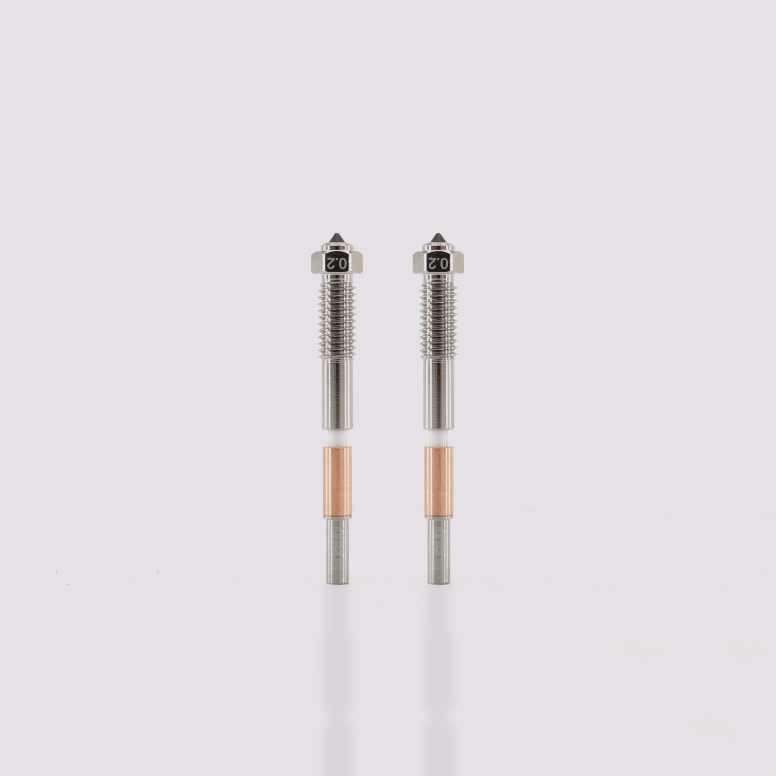 Two Q2 bimetal nozzles 0.2 mm tips with hardened steel core and copper-plated exterior