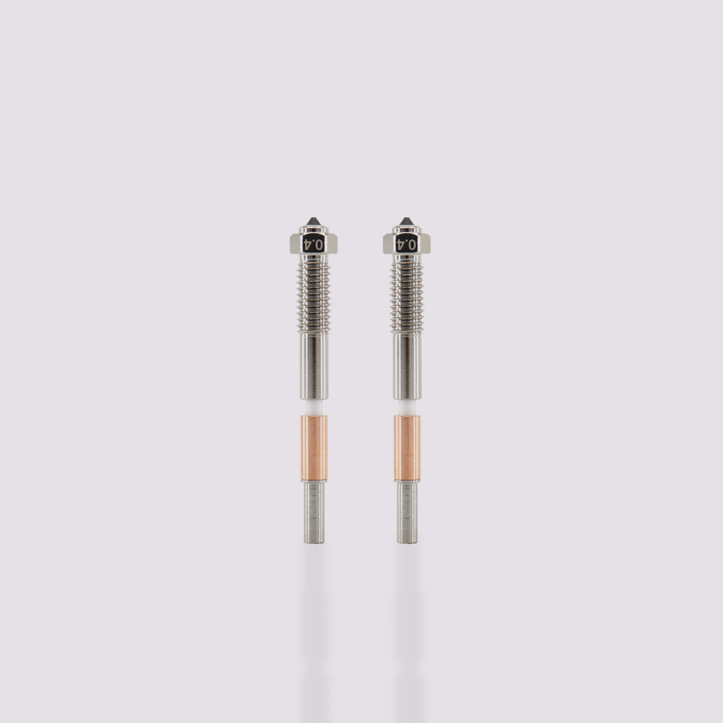 Two Q2 bimetal nozzles 0.4 mm, hardened steel and copper-plated, disassembled and assembled