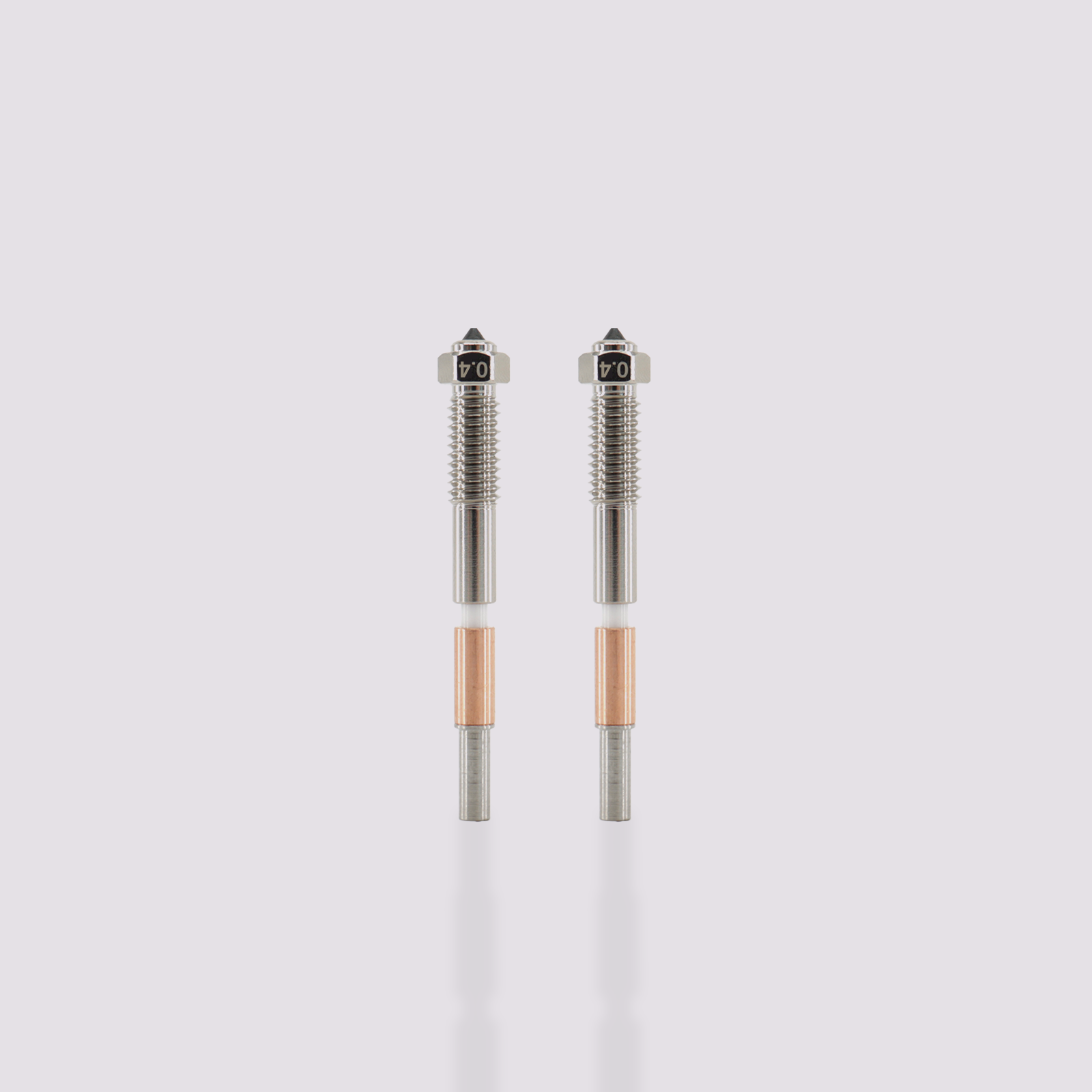 Two Q2 bimetal nozzles 0.4 mm, hardened steel and copper-plated, disassembled and assembled