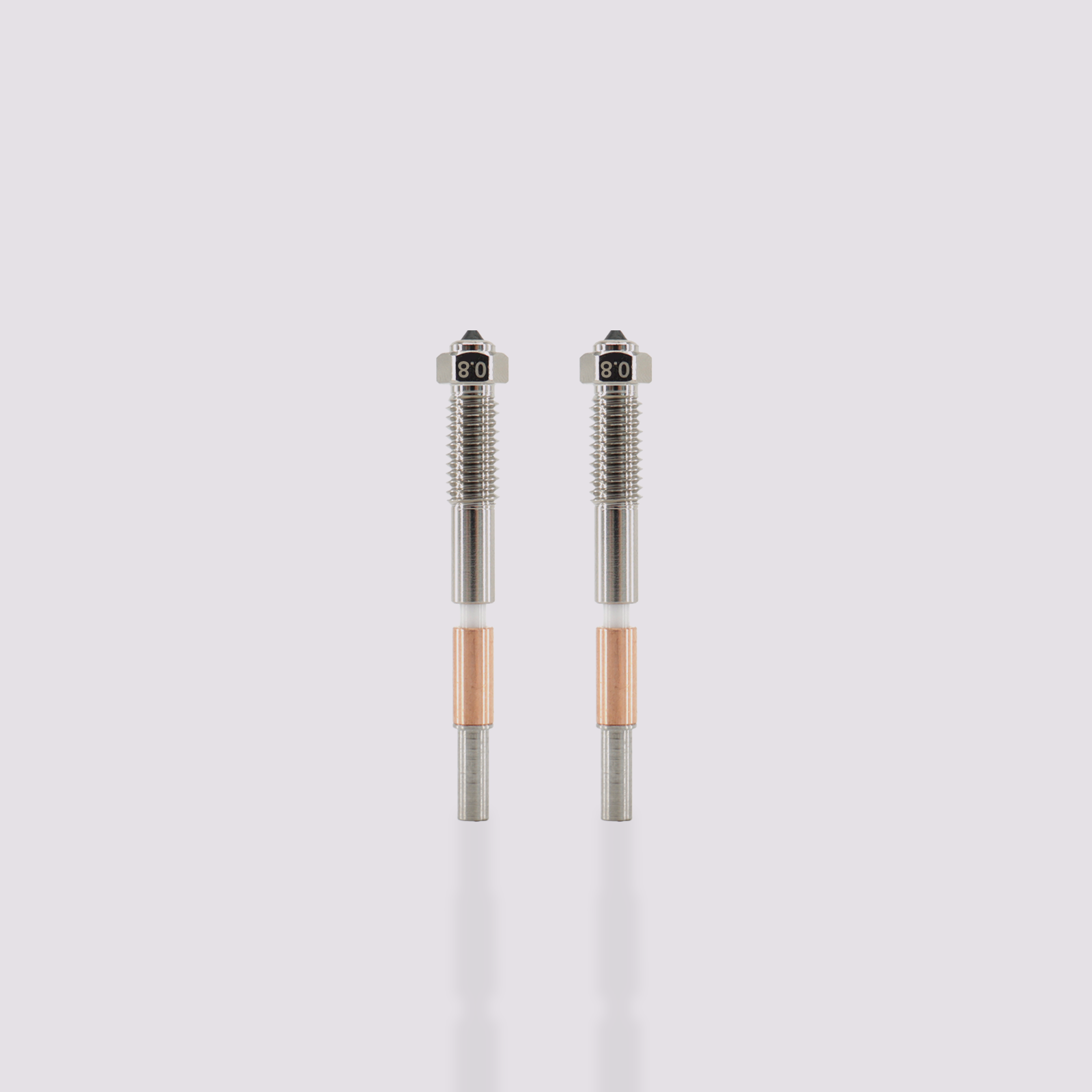 Two Q2 bimetal nozzles with 0.8 mm marking, featuring a silver threaded upper section and copper heat sink