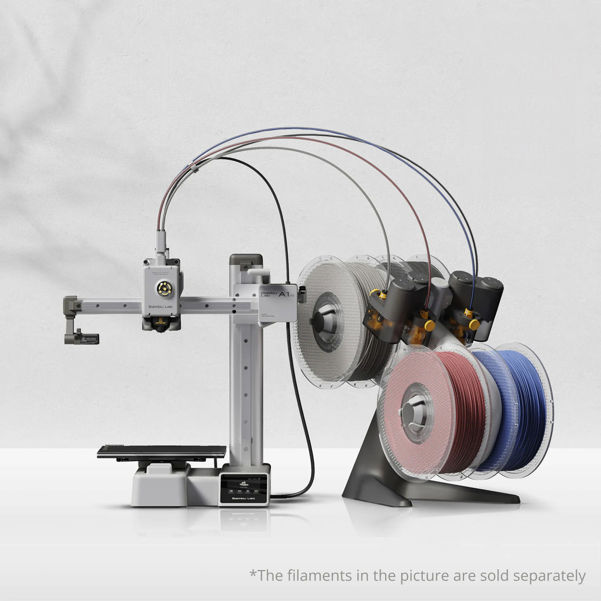 Bambu Lab A1 mini Combo 3D Printer with AMS lite; filament spools shown are illustrative